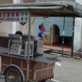 Push carts sellers went from street to street. This was a lady in her 50s pushing her already closed mobile store home.